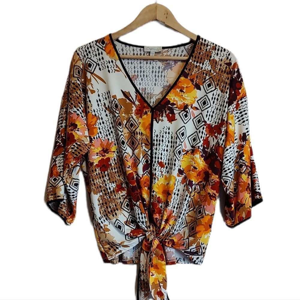 Lovely Fall Floral colored ladies blouse with tie front in size small.